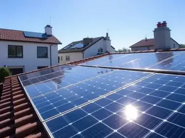 Clean solar panels glistening in sunlight on a residential rooftop